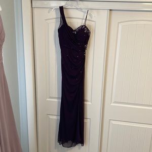 XSCAPE from David’s Bridal prom or pageant dress. Size 6. Has slit up the leg